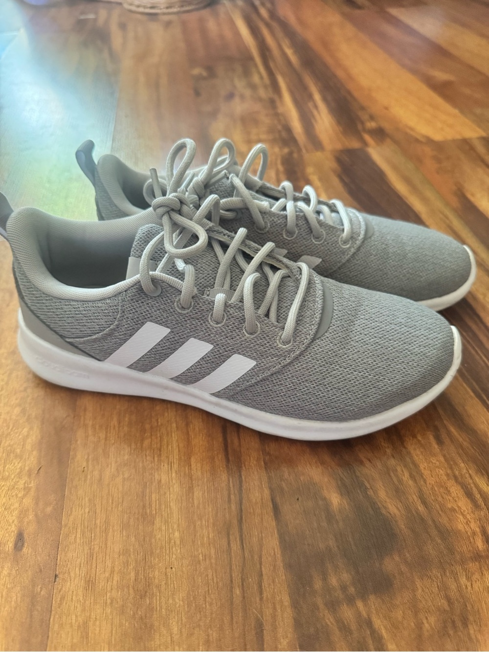 adidas women’s Light Grey Mesh Athletic Sneakers with White Stripes